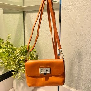 Rowallan orange leather crossbody bag. Made in Italy